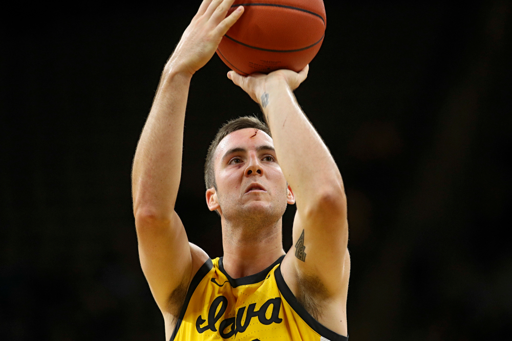 Iowa Hawkeyes guard Connor McCaffery (30) makes a free throw after getting a cut on his forehead during the first half of their game at Carver-Hawkeye Arena in Iowa City on Monday, Nov 11, 2019. (Stephen Mally/hawkeyesports.com)