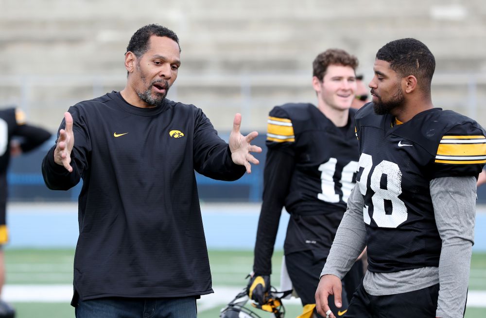 Former Hawkeye Football player Quinn Early talks with running back Toren Young (28) following Holiday Bowl Practice No. 3 Tuesday, December 24, 2019 at San Diego Mesa College. (Brian Ray/hawkeyesports.com)