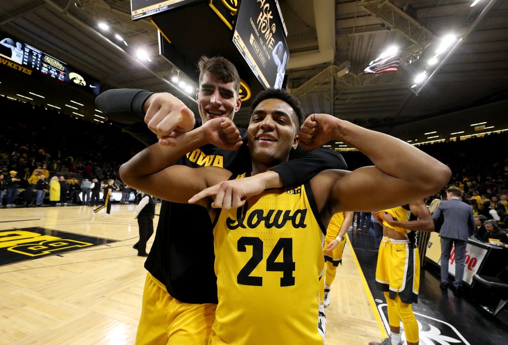 Iowa Hawkeyes guard Nicolas Hobbs (24) celebrates with forward Luka Garza (55) following their win against the Nebraska Cornhuskers Saturday, February 8, 2020 at Carver-Hawkeye Arena. (Brian Ray/hawkeyesports.com)