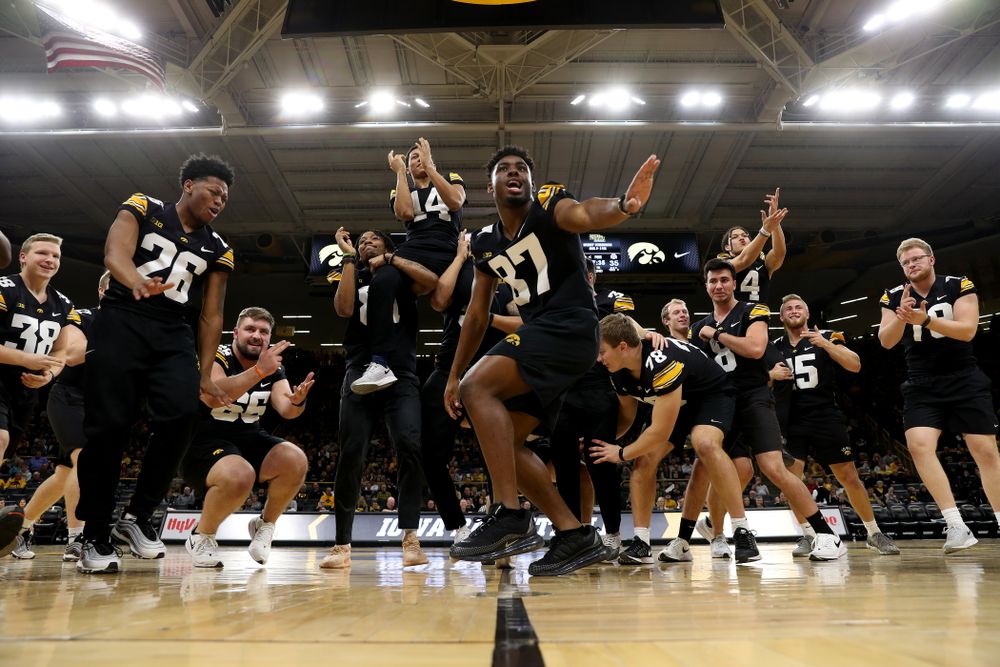 Members of the Hawkeye Football team performs with the Iowa Dance Team at halftime of the Iowa Hawkeyes game against the Ohio State Buckeyes Thursday, February 20, 2020 at Carver-Hawkeye Arena. (Brian Ray/hawkeyesports.com)
