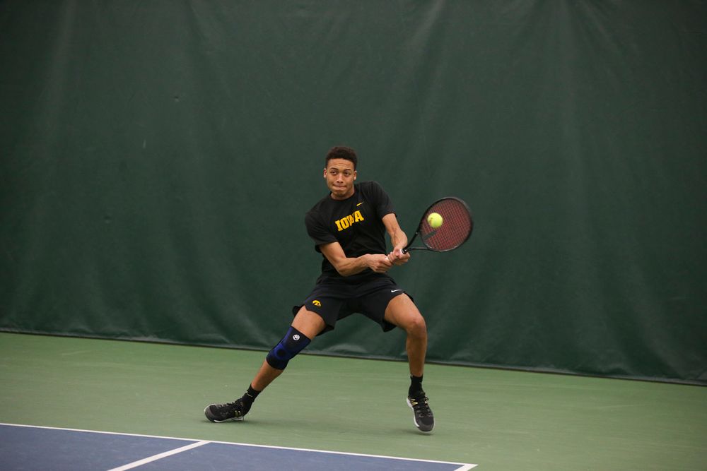 Iowa’s Oliver Okonkwo returns a ball during the Iowa men’s tennis meet vs VCU on Saturday, February 29, 2020 at the Hawkeye Tennis and Recreation Complex. (Lily Smith/hawkeyesports.com)
