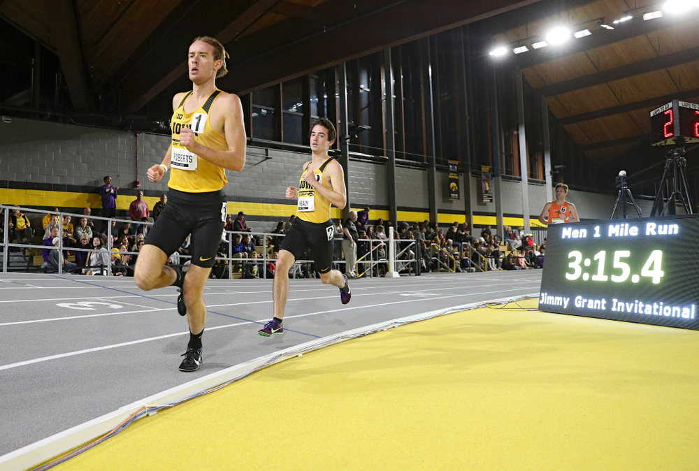Iowa’s Jeff Roberts (from left) and Noah Healy run the men’s 1 mile run event during the Jimmy Grant Invitational at the Recreation Building in Iowa City on Saturday, December 14, 2019. (Stephen Mally/hawkeyesports.com)