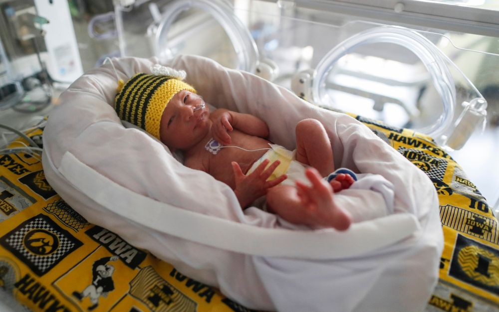 Iowa Hawkeyes offensive lineman Dalton Ferguson (76) and his girlfriend Rachael stand with their newborn twins Ella and Hazel Wednesday, September 12, 2018 in the NICU at the Stead Family Children's Hospital (Brian Ray/hawkeyesports.com)
