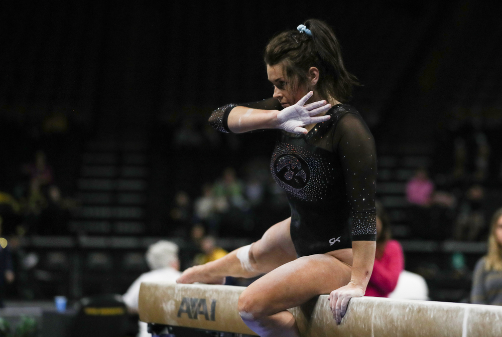 Iowa’s Erin Castle competes on the beam against Michigan Friday, February 14, 2020 at Carver-Hawkeye Arena. (Brian Ray/hawkeyesports.com)