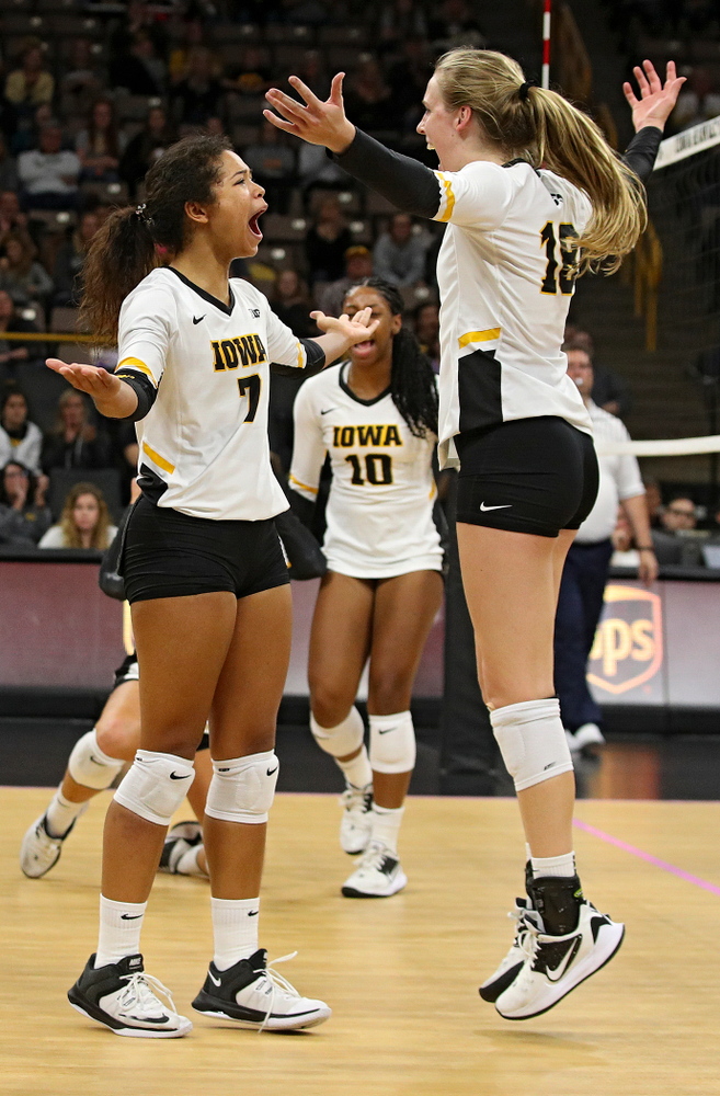 Iowa’s Brie Orr (7) and Hannah Clayton (18) celebrate a score during the fourth set of their volleyball match at Carver-Hawkeye Arena in Iowa City on Sunday, Oct 13, 2019. (Stephen Mally/hawkeyesports.com)