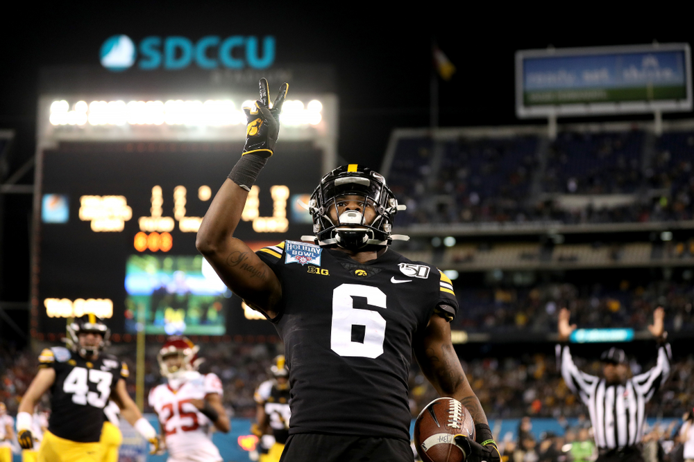 Iowa Hawkeyes wide receiver Ihmir Smith-Marsette (6) celebrates after scoring on a kick return against USC in the Holiday Bowl Friday, December 27, 2019 at San Diego Community Credit Union Stadium. (Brian Ray/hawkeyesports.com)