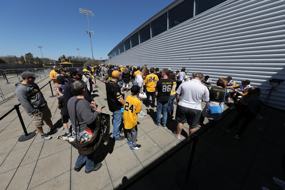 Members of the Iowa Football team sign autographs before the Iowa Hawkeyes game against the Nebraska Cornhuskers Saturday, April 20, 2019 at Duane Banks Field. (Brian Ray/hawkeyesports.com)