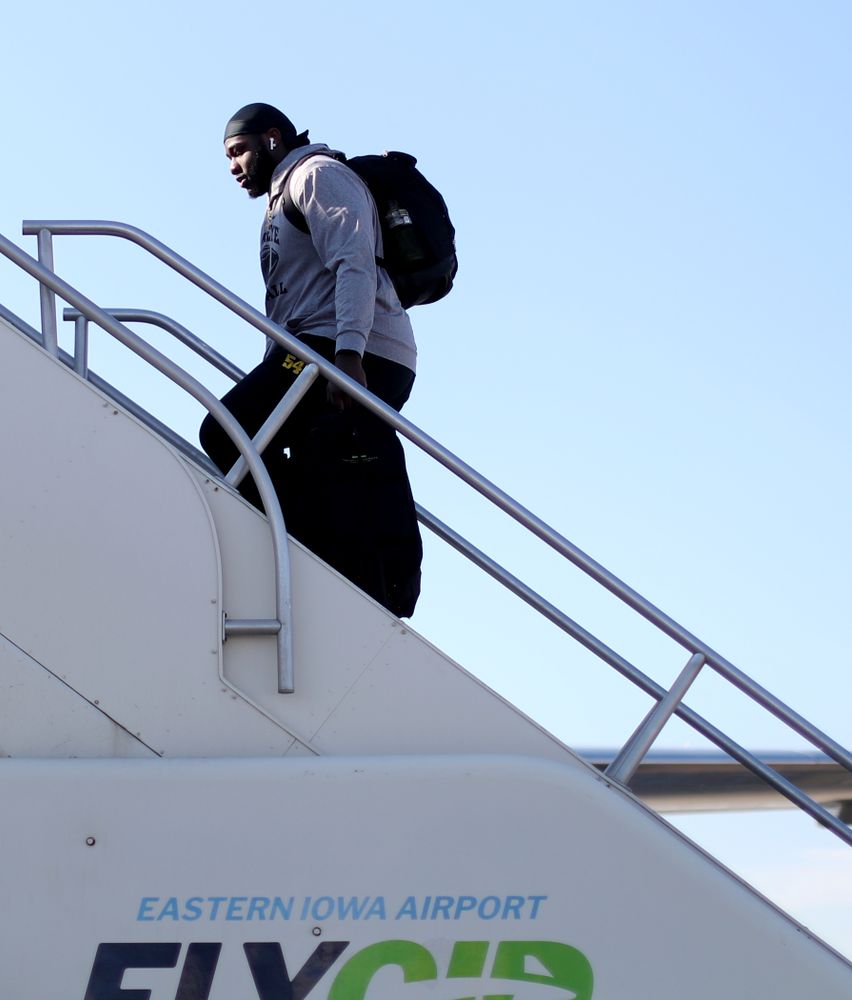 Iowa Hawkeyes defensive tackle Daviyon Nixon (54) boards the team plane at the Eastern Iowa Airport Saturday, December 21, 2019 on the way to San Diego, CA for the Holiday Bowl. (Brian Ray/hawkeyesports.com)