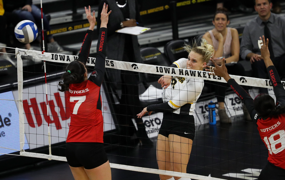 Iowa Hawkeyes right side hitter Reghan Coyle (8) spikes the ball during a match against Rutgers at Carver-Hawkeye Arena on November 2, 2018. (Tork Mason/hawkeyesports.com)