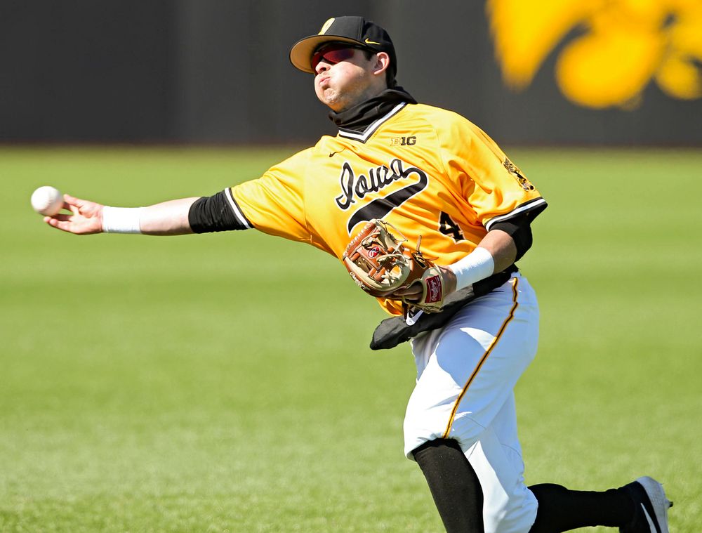 Iowa Hawkeyes second baseman Mitchell Boe (4) throws to first for an out during the eighth inning against Illinois at Duane Banks Field in Iowa City on Sunday, Mar. 31, 2019. (Stephen Mally/hawkeyesports.com)