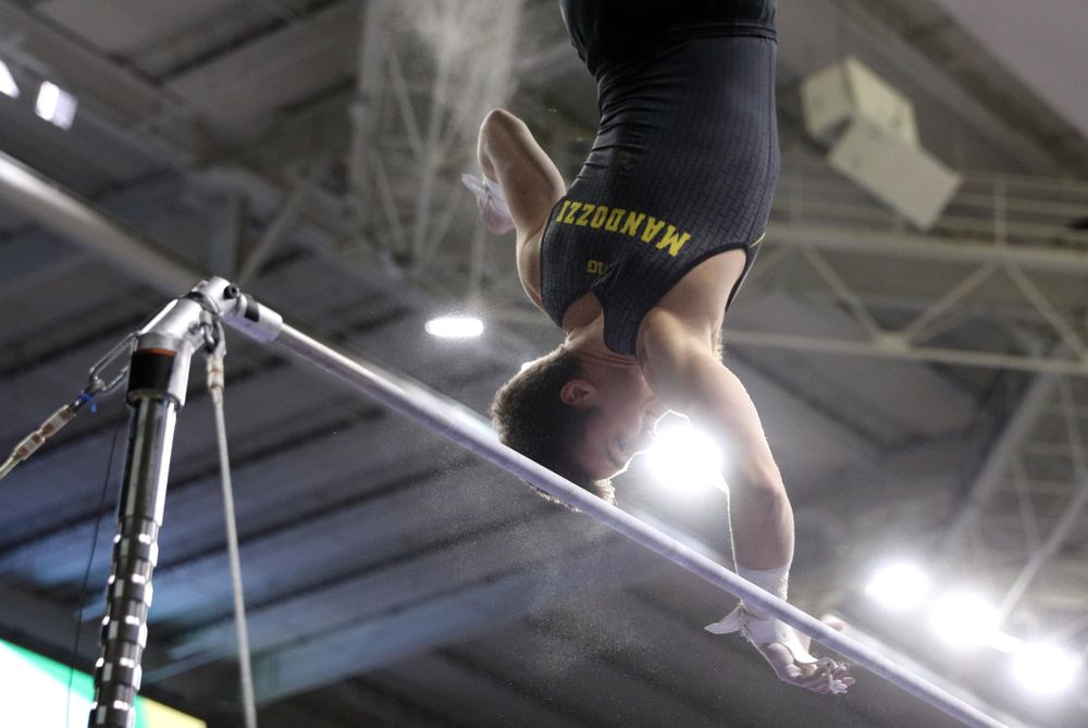 Iowa's Mitch Mandozzi competes on the high bar against the Ohio State Buckeyes Saturday, March 16, 2019 at Carver-Hawkeye Arena. (Brian Ray/hawkeyesports.com)
