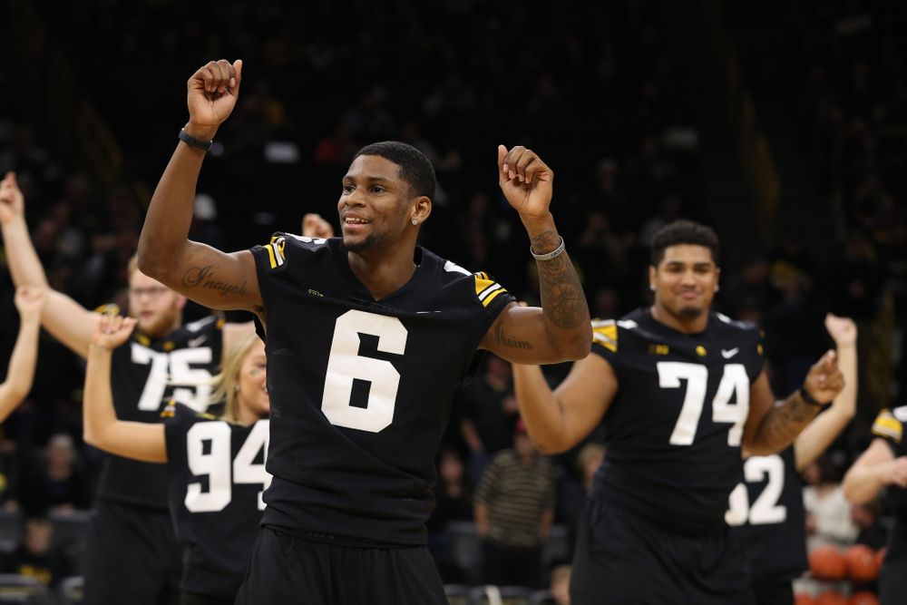 The Iowa Dance Team performs with the Iowa Football Team at halftime of the Iowa Hawkeyes game against the Indiana Hoosiers Friday, February 22, 2019 at Carver-Hawkeye Arena. (Brian Ray/hawkeyesports.com)