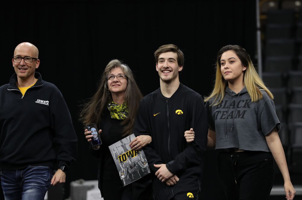 Iowa Men's Gymnast Kevin Johnson and his family during senior day ceremonies following their meet against the Ohio State Buckeyes Saturday, March 16, 2019 at Carver-Hawkeye Arena. (Brian Ray/hawkeyesports.com)