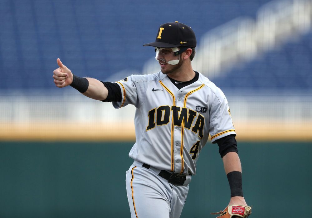 Iowa Hawkeyes Tanner Wetrich (16) and infielder Mitchell Boe (4) celebrate after tuning a double play against the Indiana Hoosiers in the first round of the Big Ten Baseball Tournament Wednesday, May 22, 2019 at TD Ameritrade Park in Omaha, Neb. (Brian Ray/hawkeyesports.com)