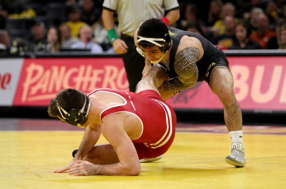 IowaÕs Pat Lugo wrestles WisconsinÕs Cole Martin at 149 pounds Sunday, December 1, 2019 at Carver-Hawkeye Arena. Lugo won the match 5-3. (Brian Ray/hawkeyesports.com)