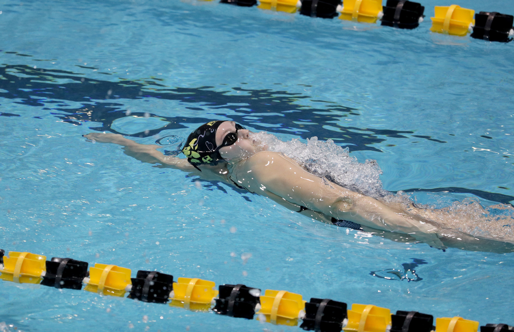 IowaÕs Emilia Sansome competes in the 100 yard backstroke against Notre Dame and Illinois Saturday, January 11, 2020 at the Campus Recreation and Wellness Center. (Brian Ray/hawkeyesports.com)
