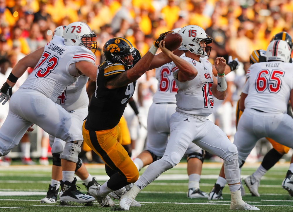 Iowa Hawkeyes defensive end A.J. Epenesa (94) knocks the ball away from Northern Illinois Huskies quarterback Marcus Childers (15) Saturday, September 1, 2018 at Kinnick Stadium. (Brian Ray/hawkeyesports.com)