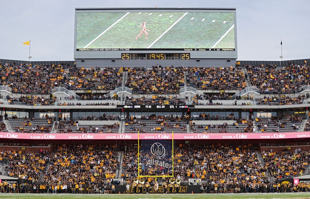 Unversity of Iowa Golden Girl Kylene Spanbauer leads the Hawkeye Marching Band onto the field before the game at Kinnick Stadium in Iowa City on Saturday, Aug 31, 2019. (Stephen Mally/hawkeyesports.com)