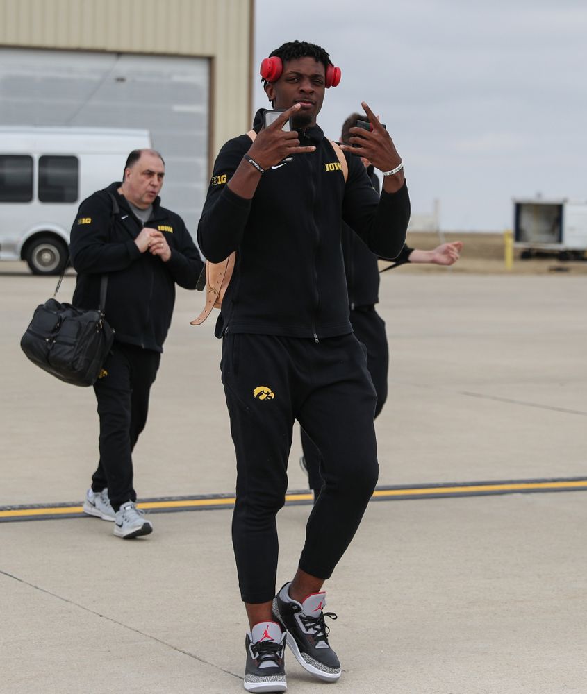 Iowa Hawkeyes forward Tyler Cook (25) boards a flight to Columbus for the first and second rounds of the 2019 NCAA Men's Basketball Tournament Wednesday, March 20, 2019 at the Eastern Iowa Airport. (Brian Ray/hawkeyesports.com)