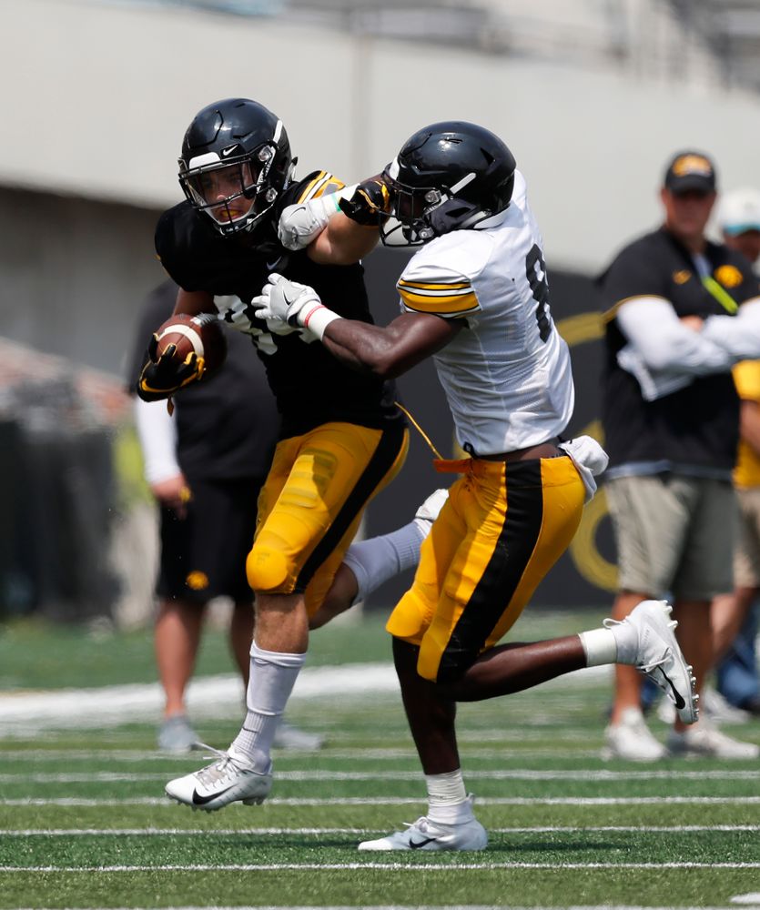 Iowa Hawkeyes wide receiver Nick Easley (84) and defensive back Matt Hankins (8) during Kids Day Saturday, August 11, 2018 at Kinnick Stadium. (Brian Ray/hawkeyesports.com)