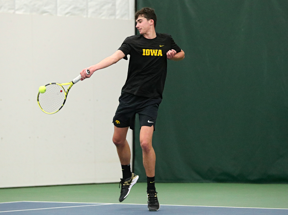 Iowa’s Matt Clegg returns a shot during his doubles match at the Hawkeye Tennis and Recreation Complex in Iowa City on Friday, February 14, 2020. (Stephen Mally/hawkeyesports.com)