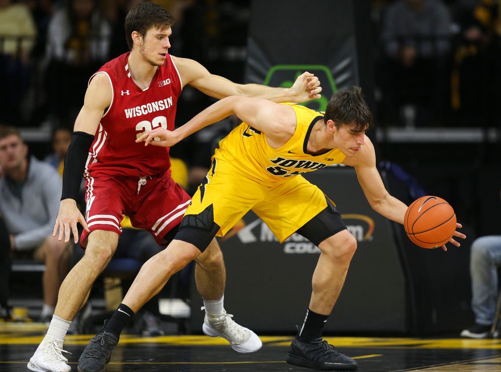 Iowa Hawkeyes forward Luka Garza (55) corrals a pass against Wisconsin on November 30, 2018 at Carver-Hawkeye Arena. (Tork Mason/hawkeyesports.com)