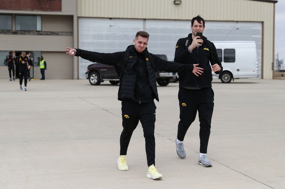Iowa Hawkeyes guard Jordan Bohannon (3) and forward Ryan Kriener (15) board a flight to Columbus for the first and second rounds of the 2019 NCAA Men's Basketball Tournament Wednesday, March 20, 2019 at the Eastern Iowa Airport. (Brian Ray/hawkeyesports.com)