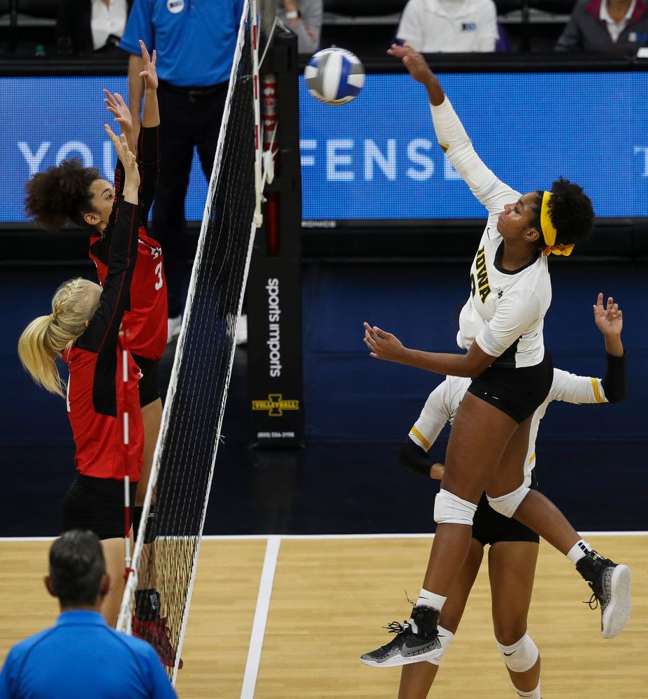 Iowa Hawkeyes middle blocker Amiya Jones (9) spikes the ball during a match against Rutgers at Carver-Hawkeye Arena on November 2, 2018. (Tork Mason/hawkeyesports.com)