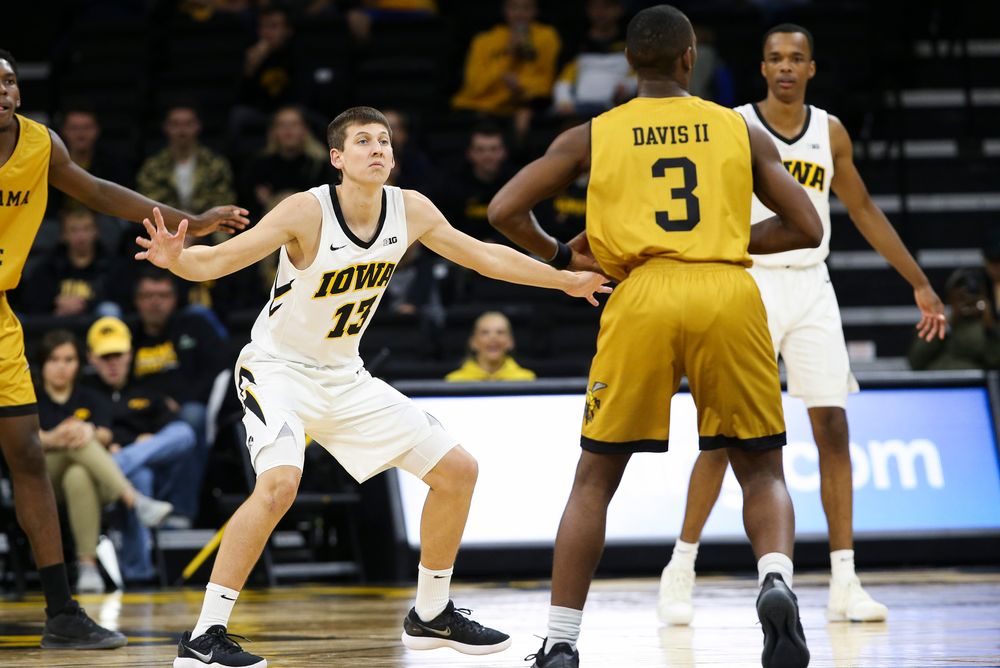 Iowa Hawkeyes guard Austin Ash (13) defends during a game against Alabama State at Carver-Hawkeye Arena on November 21, 2018. (Tork Mason/hawkeyesports.com)