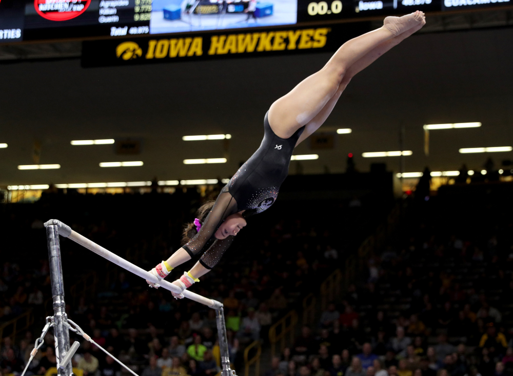 Iowa’s Carina Tolan competes on the bars against Michigan Friday, February 14, 2020 at Carver-Hawkeye Arena. (Brian Ray/hawkeyesports.com)