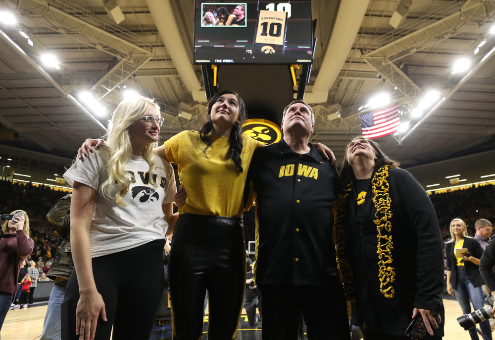 Megan Gustafson stands with her family as her number is raised into the rafters during a jersey retirement ceremony Sunday, January 26, 2020 at Carver-Hawkeye Arena. (Brian Ray/hawkeyesports.com)