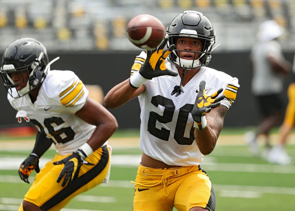 Iowa Hawkeyes defensive back Julius Brents (20) pulls in a pass during Fall Camp Practice No. 8 at Kids Day at Kinnick Stadium in Iowa City on Saturday, Aug 10, 2019. (Stephen Mally/hawkeyesports.com)