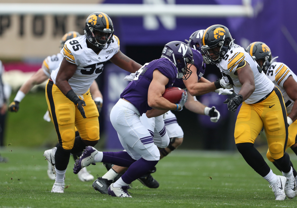 Iowa Hawkeyes defensive lineman Cedrick Lattimore (95) and defensive end Chauncey Golston (57) against the Northwestern Wildcats Saturday, October 26, 2019 at Ryan Field in Evanston, Ill. (Brian Ray/hawkeyesports.com)