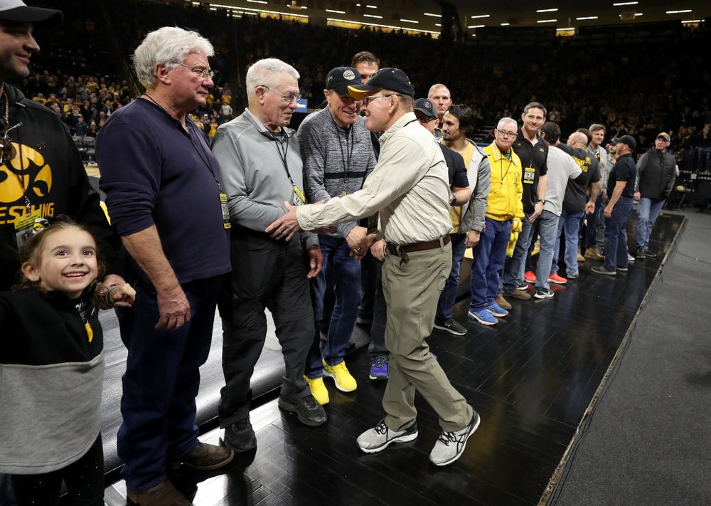 Legendary former head coach Dan Gable shakes hands with Iowa Wrestling alumni during the Iowa Hawkeyes dual against Oklahoma State Sunday, February 23, 2020 at Carver-Hawkeye Arena. (Brian Ray/hawkeyesports.com)
