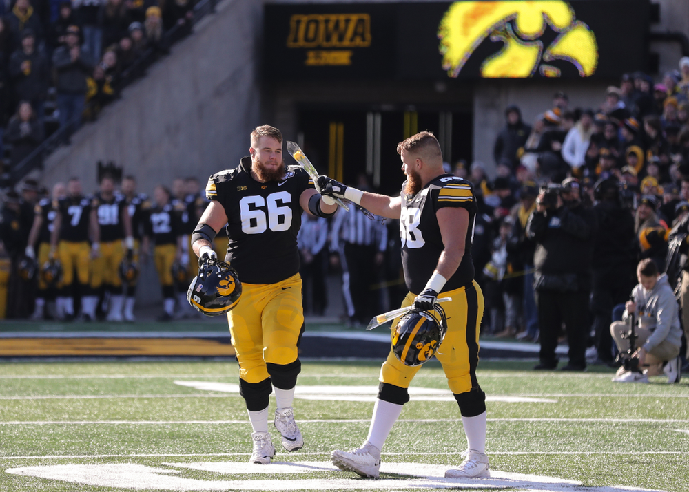 Iowa Hawkeyes offensive lineman Landan Paulsen (68) and offensive lineman Levi Paulsen (66) during Senior Day festivities before their game against the Illinois Fighting Illini Saturday, November 23, 2019 at Kinnick Stadium. (Brian Ray/hawkeyesports.com)