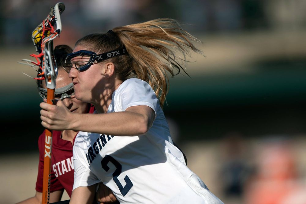 STANFORD, California - FEBRUARY 14: Virginia Cavaliers midfield Sammy Mueller (2) is defended by Stanford Cardinal defense Kyra Pelton (8) during the first half at Cagan Stadium on February 14, 2020 in Stanford, California. The Virginia Cavaliers defeated the Stanford Cardinal 12-11. (Photo by Jason O. Watson)