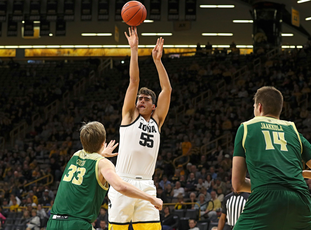 Iowa Hawkeyes center Luka Garza (55) makes a basket during the first half of their game at Carver-Hawkeye Arena in Iowa City on Sunday, Nov 24, 2019. (Stephen Mally/hawkeyesports.com)