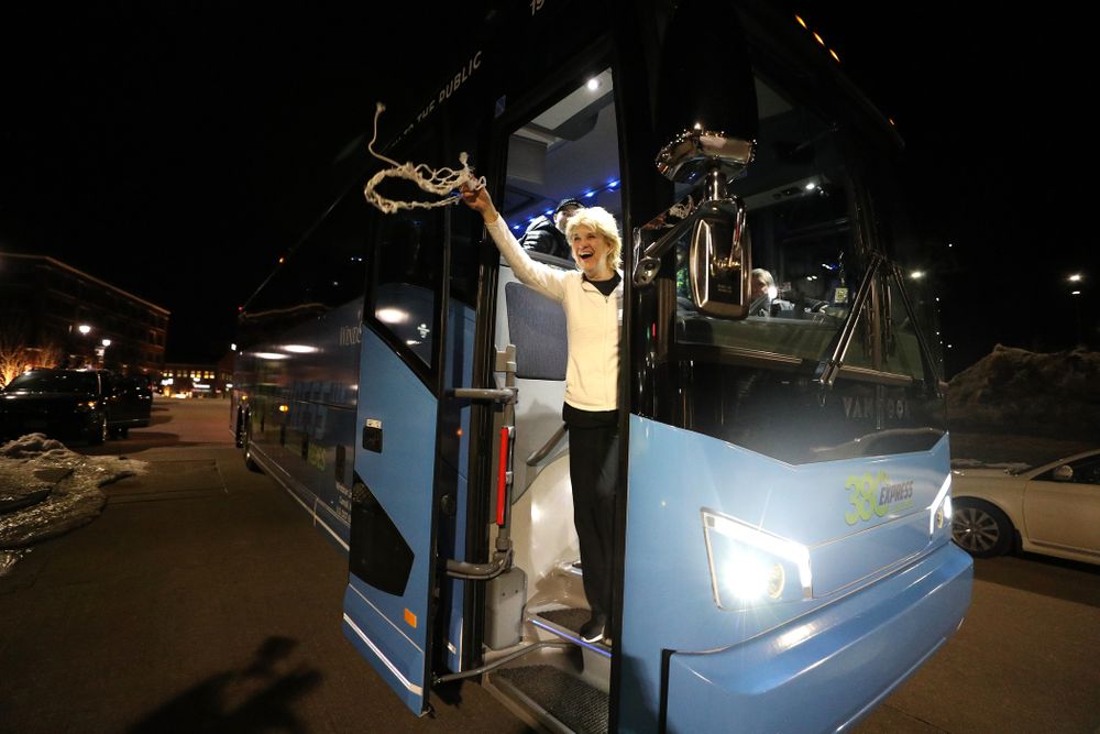 Iowa Hawkeyes head coach Lisa Bluder celebrates with fans as they arrive back in Coralville after defeating the Maryland Terrapins in the Big Ten Championship Game Sunday, March 10, 2019 in Indianapolis, Ind. (Brian Ray/hawkeyesports.com)