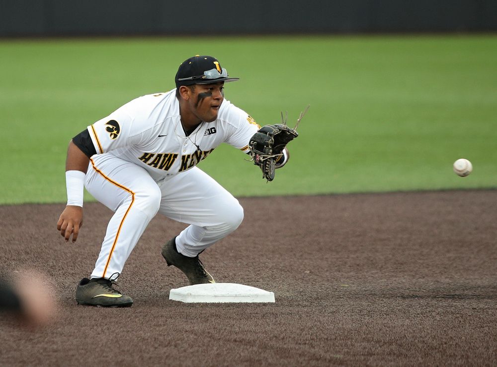 Iowa second baseman Izaya Fullard (20) pulls in a throw before tagging out Kansas’ Blaine Ray as he is caught stealing during the fourth inning of their college baseball game at Duane Banks Field in Iowa City on Wednesday, March 11, 2020. (Stephen Mally/hawkeyesports.com)