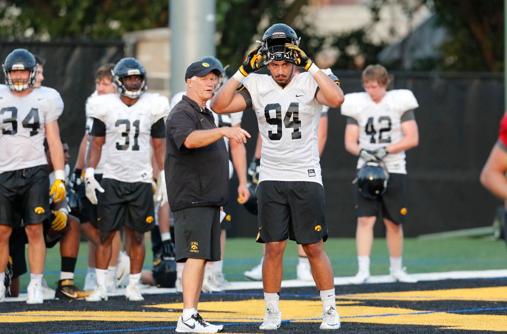 Defensive Line Coach Reese Morgan and defensive end A.J. Epenesa (94) during fall camp practice No. 4 Wednesday, August 2, 2017 at the Kenyon Football Practice Facility. (Brian Ray/hawkeyesports.com)