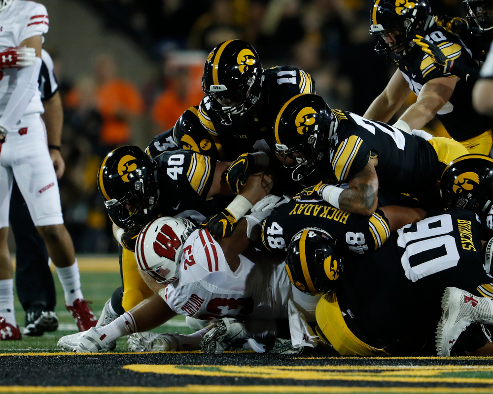 Iowa Hawkeyes defensive end Parker Hesse (40), defensive back Michael Ojemudia (11), and linebacker Jack Hockaday (48) against the Wisconsin Badgers Saturday, September 22, 2018 at Kinnick Stadium. (Brian Ray/hawkeyesports.com)