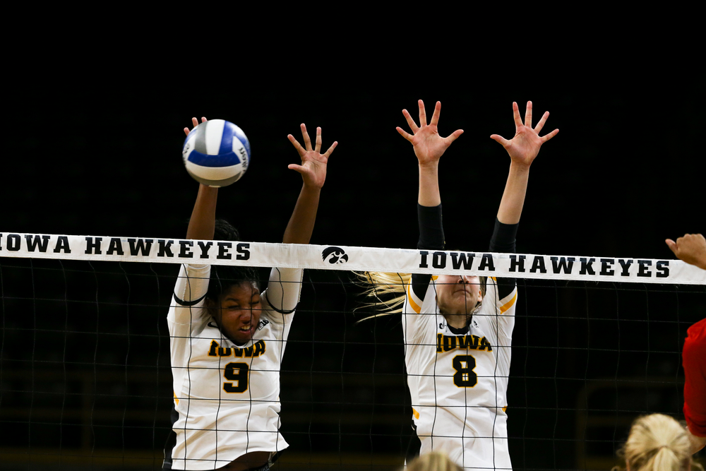 Iowa Hawkeyes middle blocker Amiya Jones (9) and Iowa Hawkeyes outside hitter Kyndra Hansen (8) during Iowa volleyball vs Maryland on Saturday, November 30, 2019 at Carver-Hawkeye Arena. (Lily Smith/hawkeyesports.com)