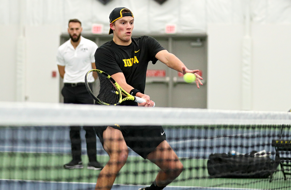 Iowa’s Joe Tyler returns a shot during his doubles match at the Hawkeye Tennis and Recreation Complex in Iowa City on Thursday, January 16, 2020. (Stephen Mally/hawkeyesports.com)
