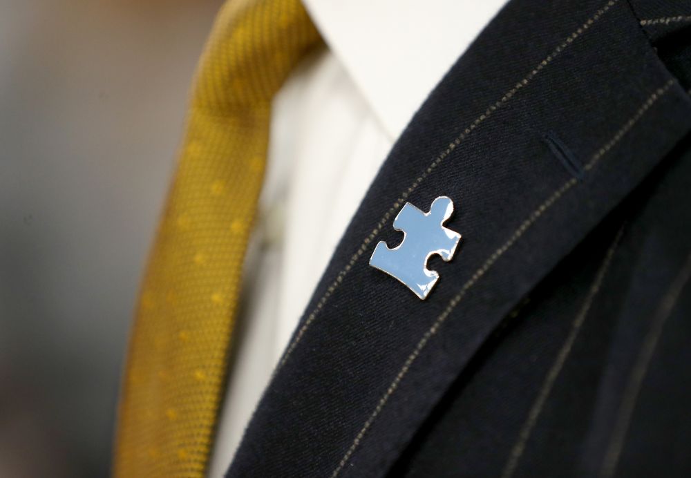 The Iowa Hawkeyes coaching staff wears Autism Awareness pins against Illinois Fighting Illini Sunday, February 2, 2020 at Carver-Hawkeye Arena. (Brian Ray/hawkeyesports.com)