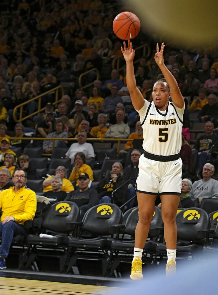 Iowa Hawkeyes guard Alexis Sevillian (5) makes a 3-pointer during the first quarter of the game at Carver-Hawkeye Arena in Iowa City on Thursday, February 6, 2020. (Stephen Mally/hawkeyesports.com)