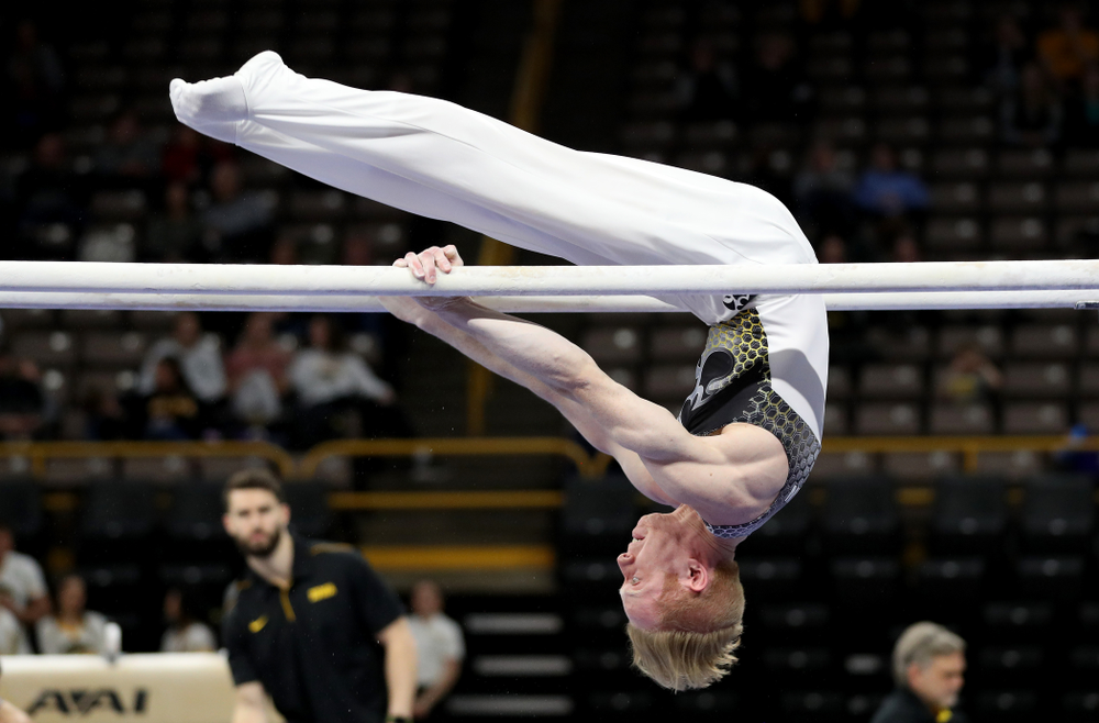 Iowa’s Nick Merryman competes on the parallel bars against UIC and Minnesota Saturday, February 1, 2020 at Carver-Hawkeye Arena. (Brian Ray/hawkeyesports.com)