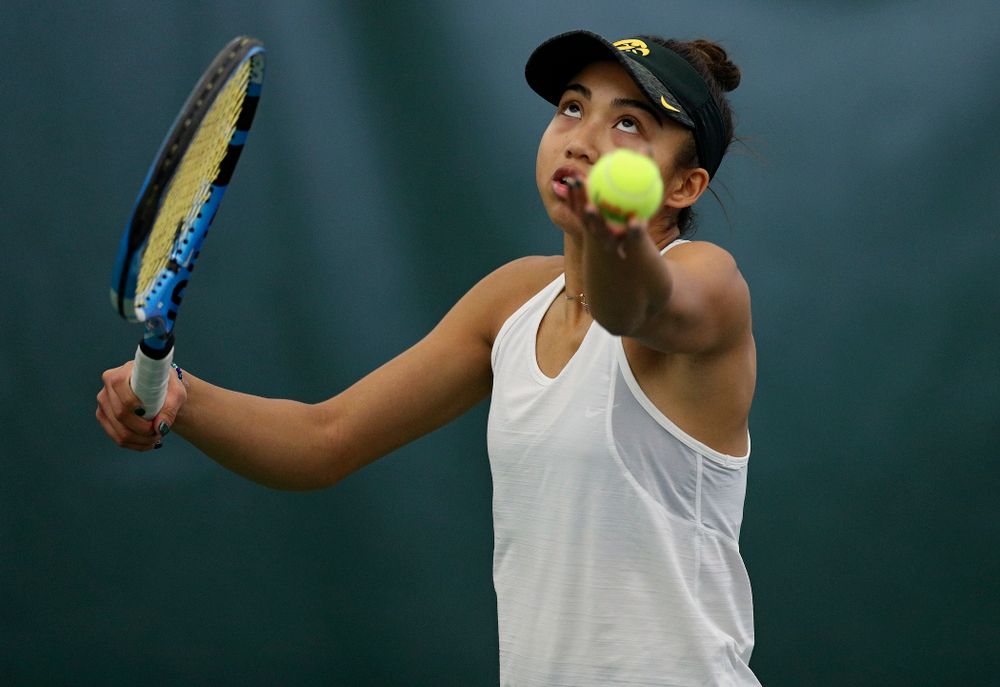 Iowa’s Michelle Bacalla serves during her singles match at the Hawkeye Tennis and Recreation Complex in Iowa City on Sunday, February 23, 2020. (Stephen Mally/hawkeyesports.com)