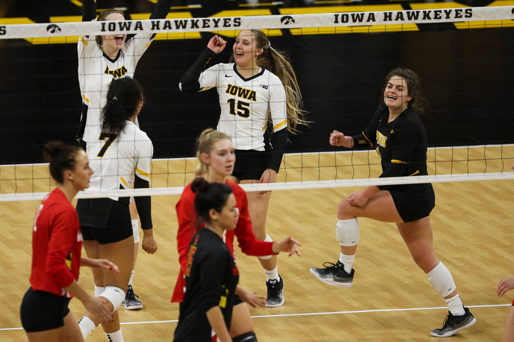 Iowa Hawkeyes defensive specialist Maddie Slagle (15) and Iowa Hawkeyes defensive specialist Molly Kelly (1) celebrate after winning a point during a match against Maryland at Carver-Hawkeye Arena on November 23, 2018. (Tork Mason/hawkeyesports.com)