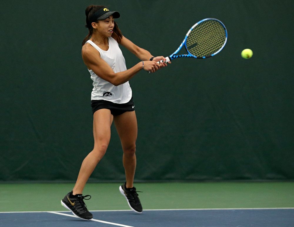 Iowa’s Michelle Bacalla returns a shot during her doubles match at the Hawkeye Tennis and Recreation Complex in Iowa City on Sunday, February 23, 2020. (Stephen Mally/hawkeyesports.com)