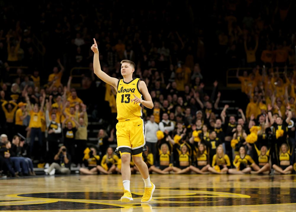 Iowa Hawkeyes guard Austin Ash (13) celebrates a three point basket against the Nebraska Cornhuskers Saturday, February 8, 2020 at Carver-Hawkeye Arena. (Brian Ray/hawkeyesports.com)